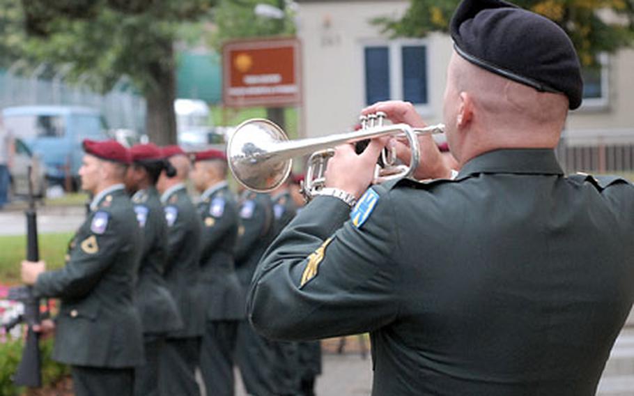 Sgt. Matthew Fattal, of the 76th Army Band plays taps for Maj. Thomas Bostick Jr. and Staff Sgt. William Fritsche at the end of the memorial service for the two 1st Squadron, 91st Cavalry soldiers at Ledward Barracks in Schweinfurt, Germany on Wednesday.