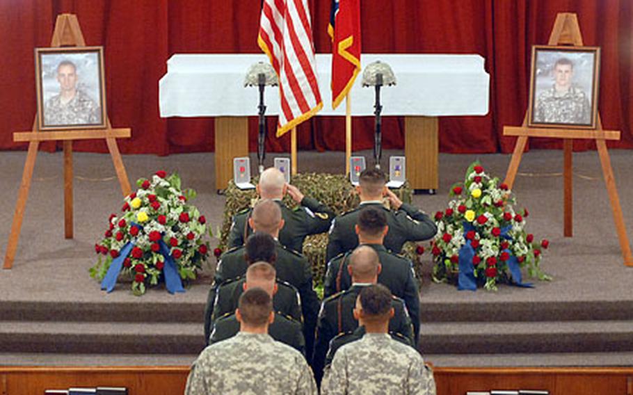 Soldiers give a final salute to Maj. Thomas Bostick Jr. and Staff Sgt. William Fritsche following the memorial service for the two 1st Squadron, 91st Cavalry Regiment soldiers at Ledward Barracks in Schweinfurt, Germany on Wednesday. Bostick and Fritsche were killed in a fire fight in Afghanistan on July 27.