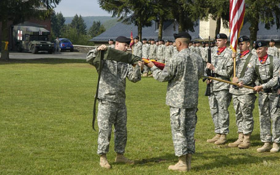 Lt. Col. Thomas Matsel, commander of the 1st Battalion 94th Field Artillery Regiment, cases the unit&#39;s colors during a farewell ceremony. The 1-94th, based out of the Strassburg Kaserne near Baumholder, is taking part in a three-month training exercise in Romania.