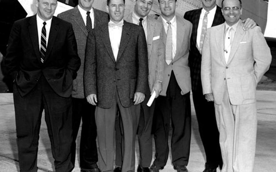 The staff for the 1955 USAFE football clinic included, left to right, Gomer Jones, assistant Oklahoma grid coach; NFL referee Ron Gibbs; Albie Booth, former Yale playing great and now an outstanding official: George Dickson, Notre Dame backfield coach; Terry Brennan, Notre Dame head coach; Bud Wilkinson, Oklahoma head coach; and Ken Rolllnson, the Oklahoma trainer.