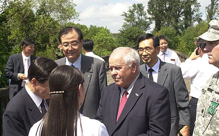 Victor Vierra, retired colonel and former commander of the U.N. Command Security Battalion, talks with South Koreans at the Bridge of No Return, a few feet from North Korean territory.