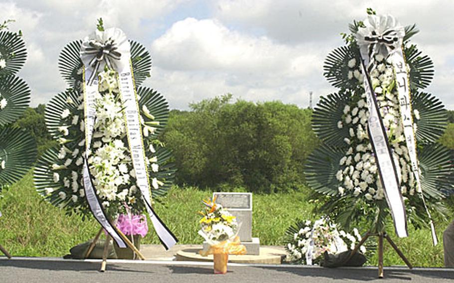 Wreaths stand at the memorial for Army Capt. Arthur Bonifas and 1st. Lt. Mark Barrett, who were killed by North Korean soldiers with axes during a tree trimming operation in 1976.