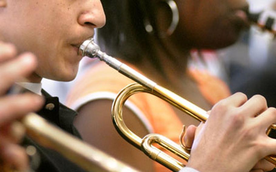 Tyler Willis, a 9th grader at Kaiserslautern High School, works his trumpet skills during band class March 12, 2007.