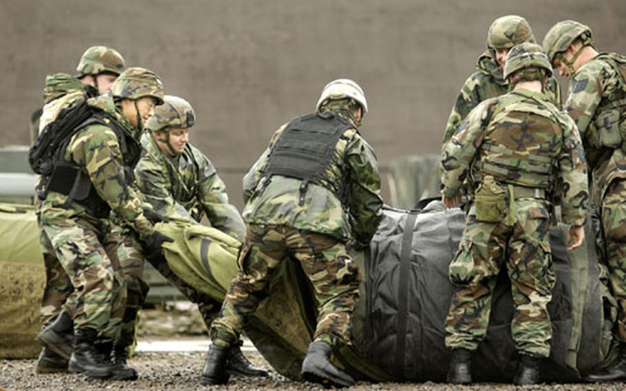 Members of the 86th Contingency Response Group open up a DRASH. The three day exercise is designed to get all the diverse Air Force specialties represented in the CRG to work as a single unit, similar to how they deploy.