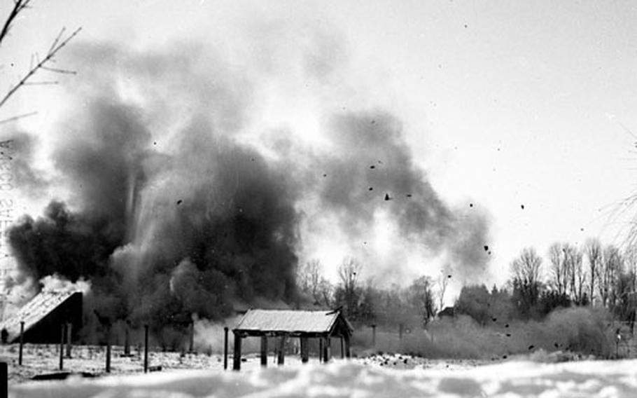 Dust and debris settle after one of the explosions.