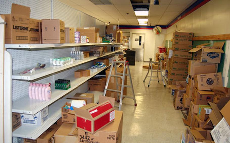 Empty shelves and discarded boxes show the Camp Long Post Exchange in its final days. AAFES officials closed the store on Sept. 14 because it was losing money.