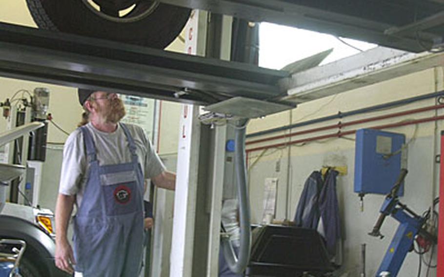 James Corley elevates a vehicle so he can change the oil. Kaiserslautern no longer has an AAFES garage to service the more than 50,000 Americans who live in the area.