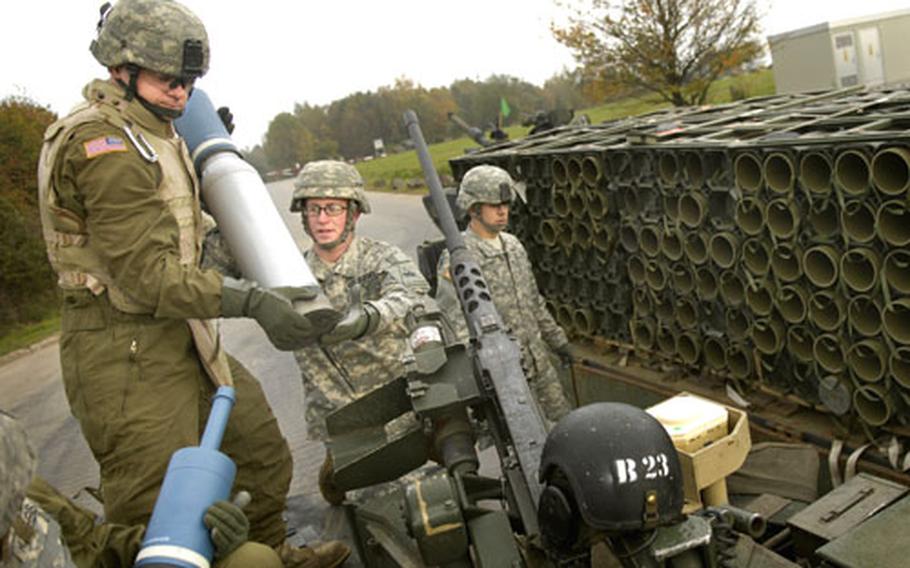 Pfc. Michael Werner, a gunner from 1st Battalion, 35th Armor Regiment “Iron Knights,” brings a 120mm “HEAT” round on board a M1A1 Abrams tank at a weapons range Wednesday near Baumholder, Germany.