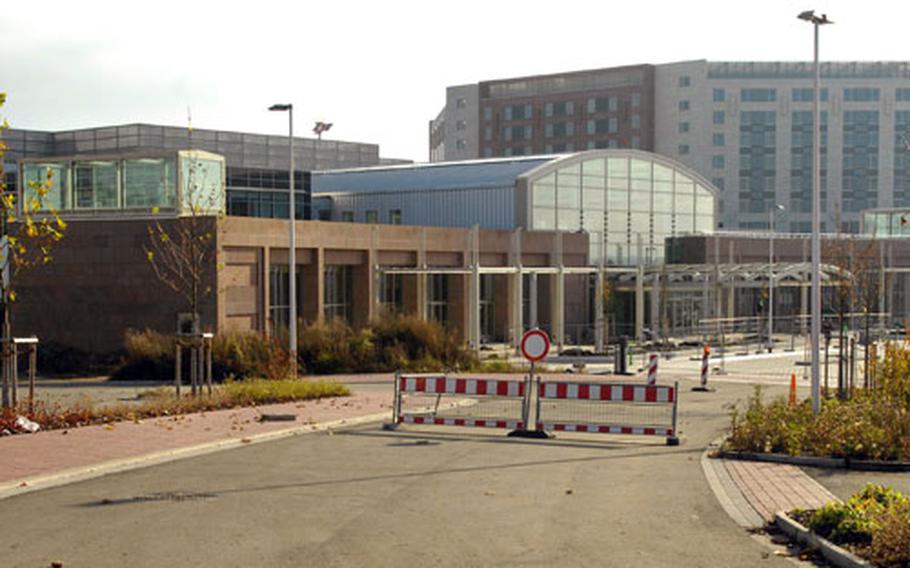 The scene outside the Kaiserslautern Military Community Center mall entrance looks all but vacant Friday at Ramstein Air Base, Germany. Federal investigators are gearing up to re-examine the troubled KMCC.