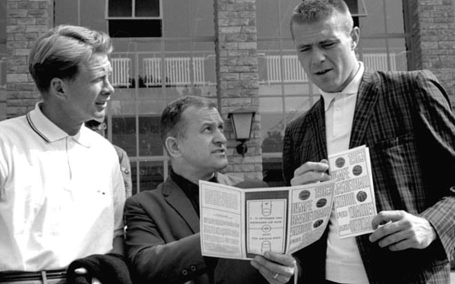 Air Force Academy basketball coach Bob Spear is flanked by a couple of future Basketball Hall of Famers, Bob Davies, left, and Tommy Heinsohn, during the 1963 USAFE clinic at Wiesbaden.