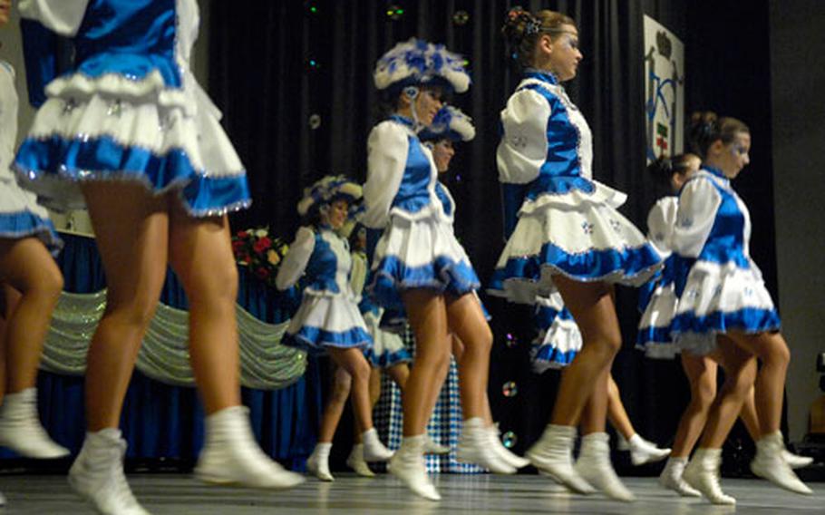 Dancers kick-off the carnival session in Piesport, Germany, Saturday night.