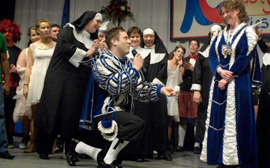 Senior Airman Vito Cipolla, Piesport Prince of Carnival, kneels before "Princess" Hildegard Sailer and asks her to marry him early Sunday morning at the conclusion of the carnival session in the town of Piesport, Germany.