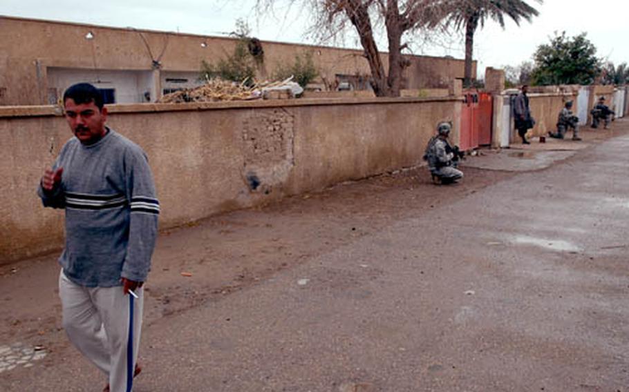 Soldiers from Company B, 1st Battalion, 15th Infantry Regiment pull security during a patrol southeast of Salman Pak.