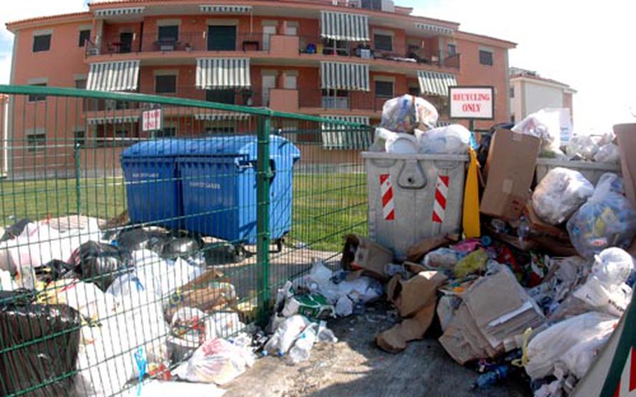 Regular garbage overflows from the "recycling only" bins at the U.S. Navy&#39;s support site base in Gricignano in Italy. Between 50 percent and 70 percent of the garbage tossed by residents of the base could be recycled and would help cut down on the amount of garbage added to the already-overfilled dumpsites in the Campania region.