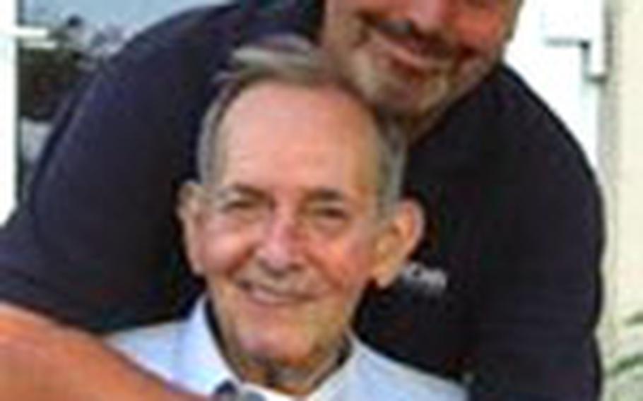 Abe and Paul Lehrer pose together for a photo during a recent family gathering.