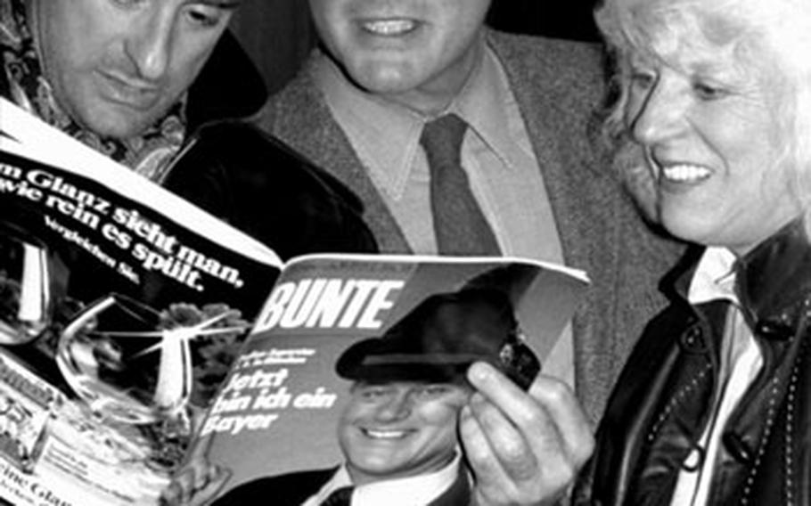 During a stopover at the Frankfurt airport in 1983, Larry Hagman — also known as the villainous J.R. in the "Dallas" TV series — checks out what's been written about him in a German magazine.