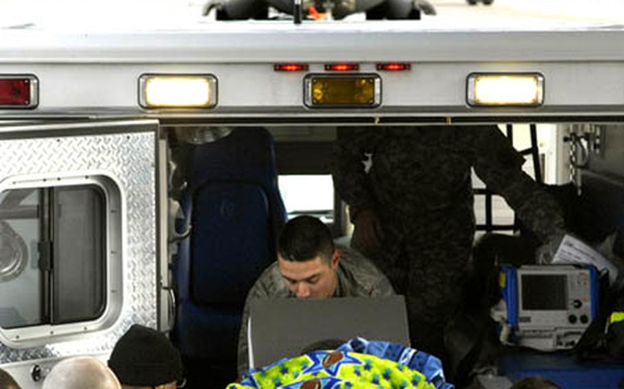 Airmen from the 435th Contingency Aeromedical Staging Facility, transport a wounded Iraqi from a C-17 to an ambulance Friday on the Ramstein Air Base flight line. Since the beginning of the war in Iraq and Afghanistan the CASF has transported more than 50,000 wounded servicemembers.