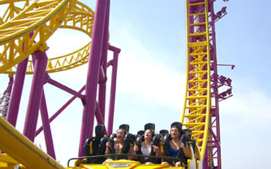 Thrill seekers scream while falling from a steep drop off on the Rage roller coaster in Adventure Island, an amusement park found along the coast of Southend-on-Sea.