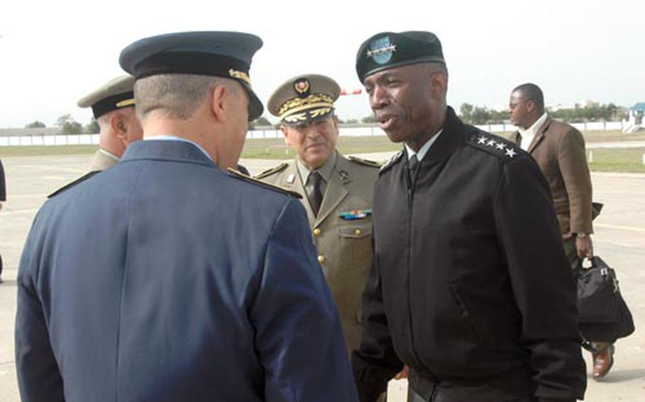 Gen. William E. "Kip" Ward, commander of U.S. Africa Command, is greeted Tuesday by Tunisian military leaders at Tunis-Carthage International Airport. Ward visited the northern Africa country for two days last week.