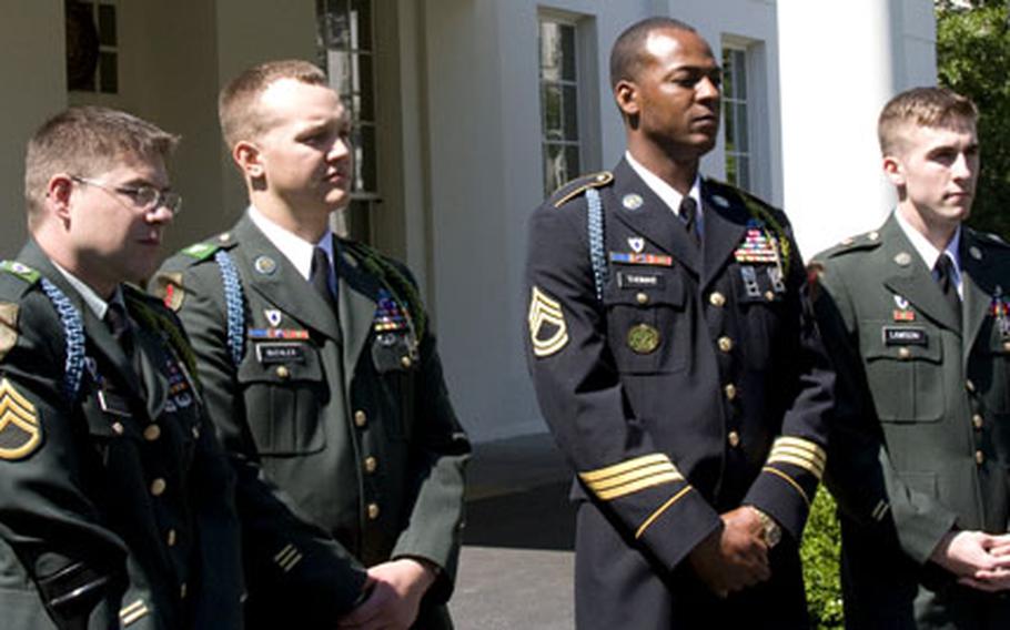 From left, retired Army Sgt. Ian Newland, Sgt. Lyle Buehler, Sgt. 1st Class Cedric Thomas and Spc. Sean Lawson speak to reporters following Monday’s White House ceremony.