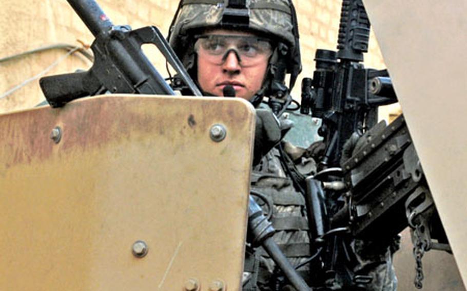 Pfc. Ross McGinnis mans his weapons in the turret of a Humvee in the Adhamiyah neighborhood of Baghdad just days before his death in 2006.