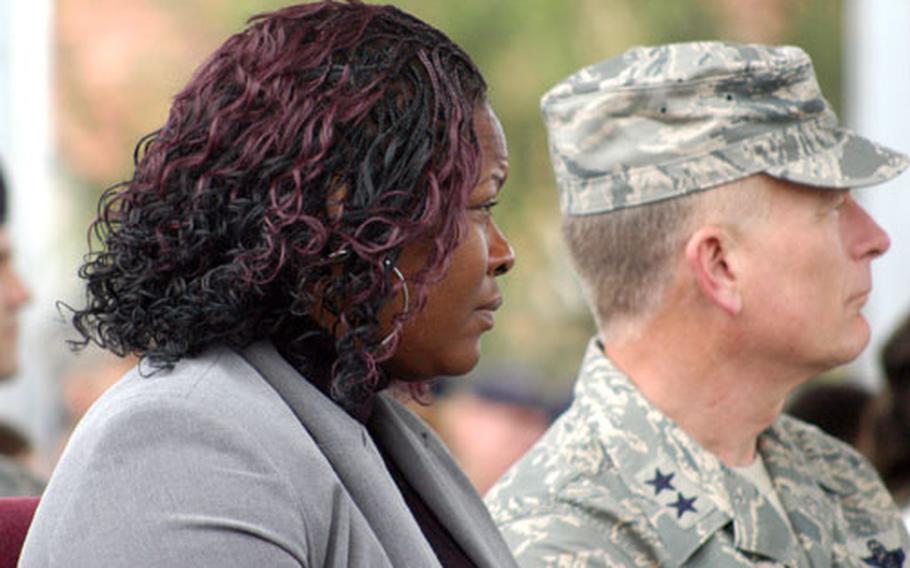 Phyllis Nathan, left, and 3rd Air Force Vice Commander Maj. Gen. Jack Egginton listen Sunday during a ceremony honoring Senior Airman Jason D. Nathan, killed in Tikrit, Iraq, on June 23.