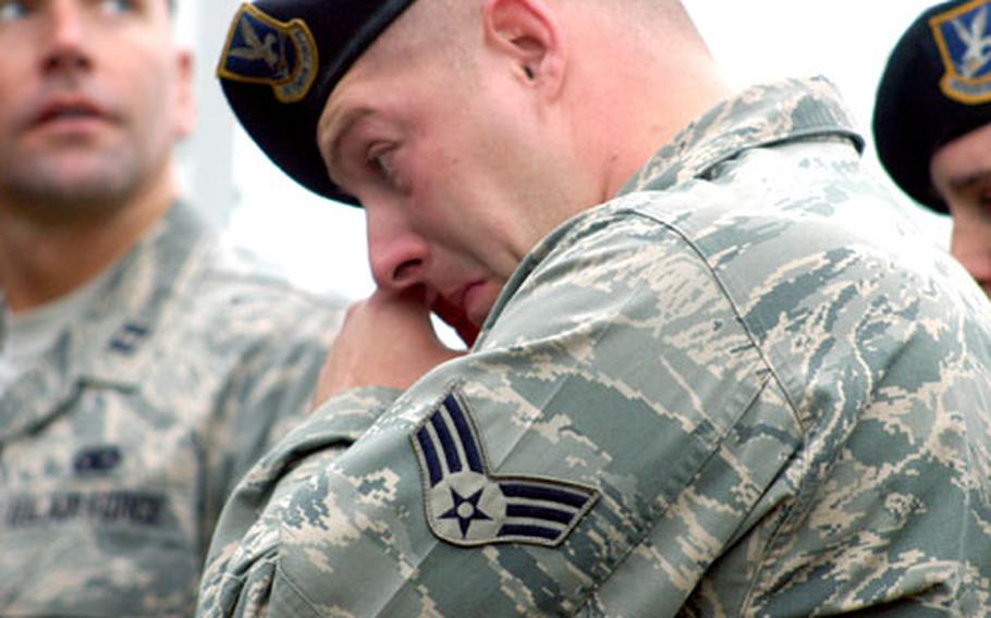 Senior Airman Derek McCaghren, of RAF Lakenheath&#39;s 48th Security Forces Squadron, fights back tears during a ceremony Sunday honoring the passing of Senior Airman Jason D. Nathan. McCaghren was one of the airmen deployed with Nathan at the time of his death.