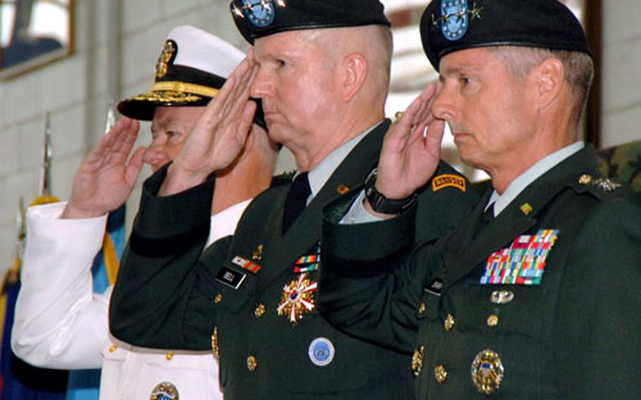 From left, Adm. Timothy Keating, commander of the U.S. Pacific Command; Gen. B.B. Bell, former U.S. Forces Korea commander; and Gen. Walter Sharp, new U.S. Forces Korea commander, salute during a change of command ceremony Tuesday at Yongsan Garrison, South Korea.