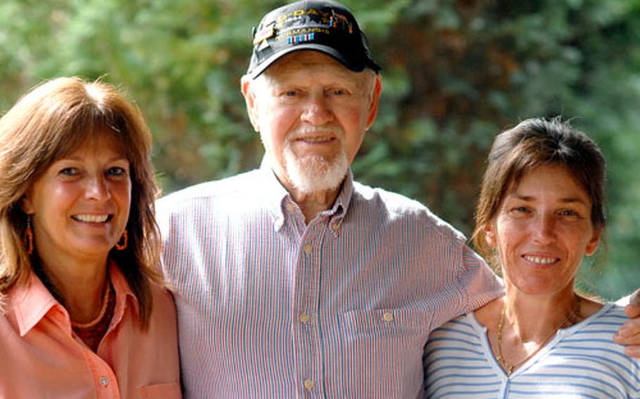 World War II veteran Dennis Shryock with his daughters Donna Barlow, left, and Kelly Hampton, right. Shryock went ashore at Utah Beach on D-Day as a member of a U.S. Navy underwater demolition team. He will be visiting Utah Beach for the first time since 1944.