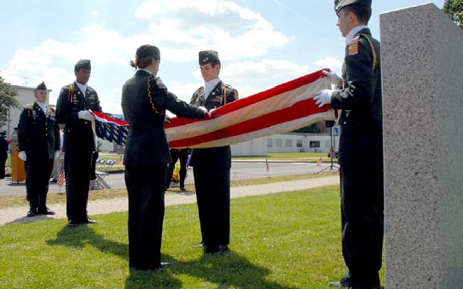 Members of the 11th Jr. ROTC Battalion and students from Würzburg American High School retire the colors one final time.