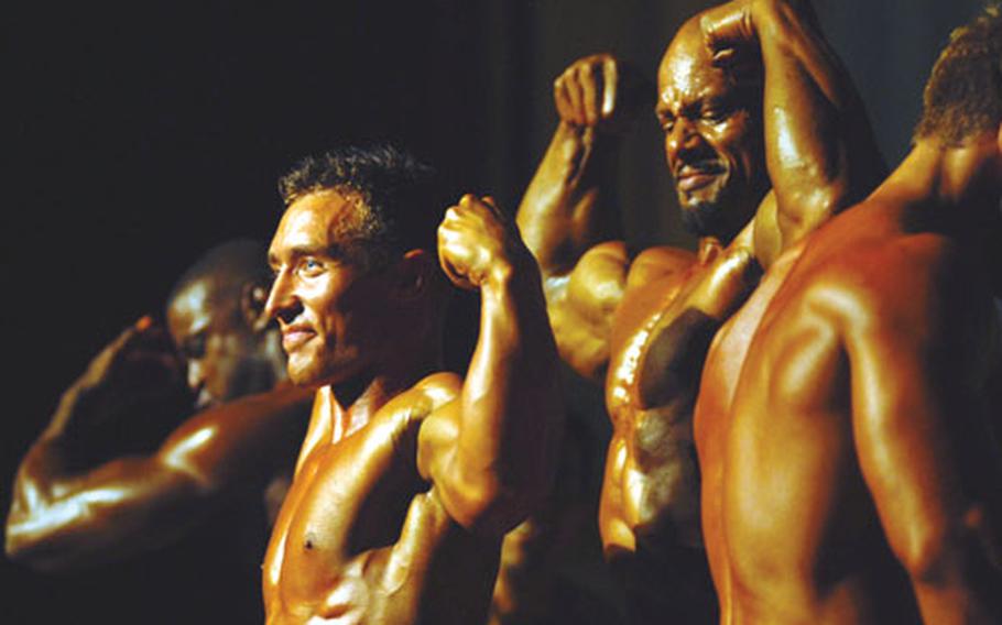 From left, men&#39;s light-heavyweight champion Timothy Martin, lightweight champion Ryan Baker, heavyweight champion Roosevelt Moody and middleweight champion Christopher Enos of Kadena Air Base engage in a posedown to determine the men&#39;s overall champion in the 2nd Pacific Muscle Classic bodybuilding competition. Moody won the award, and also the best poser award.