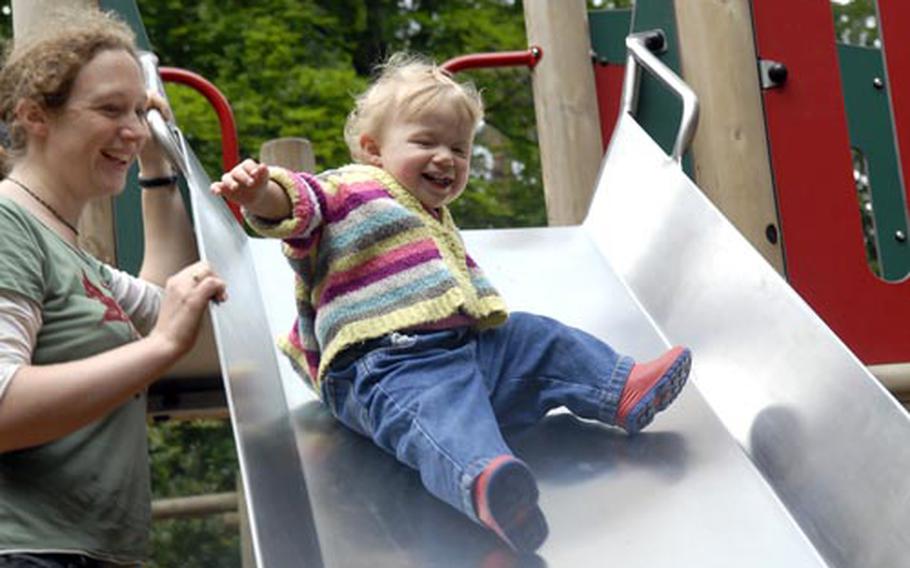 Sara Rootham plays with her one-year-old daughter Alyssa at the playground at Brandon Country Park.