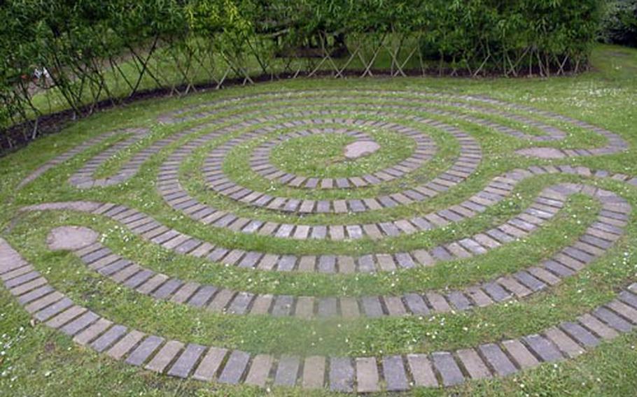 A snake-shaped labyrinth in the grass is an interesting surprise within the walled garden at Brandon Country Park.