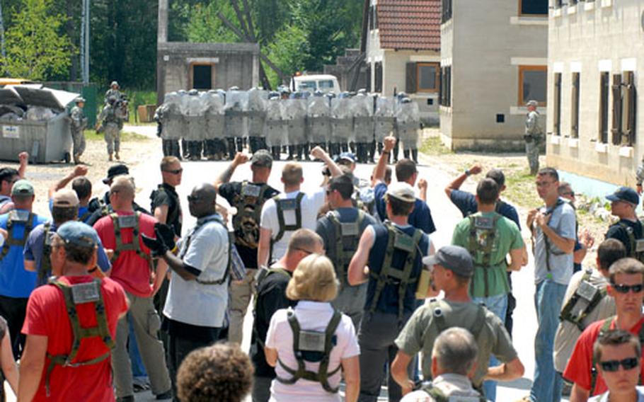 National Guard troops stand ready for a group of "rioters" headed their way.