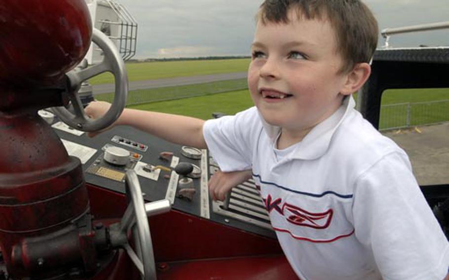 Samuel-Jay Hale, 7, plays on a fire truck from the 48th Civil Engineer Squadron. The Red Lodge resident was one of 300 Suffolk-area youth who spent Friday at the American Air Museum with airmen from RAF Lakenheath.