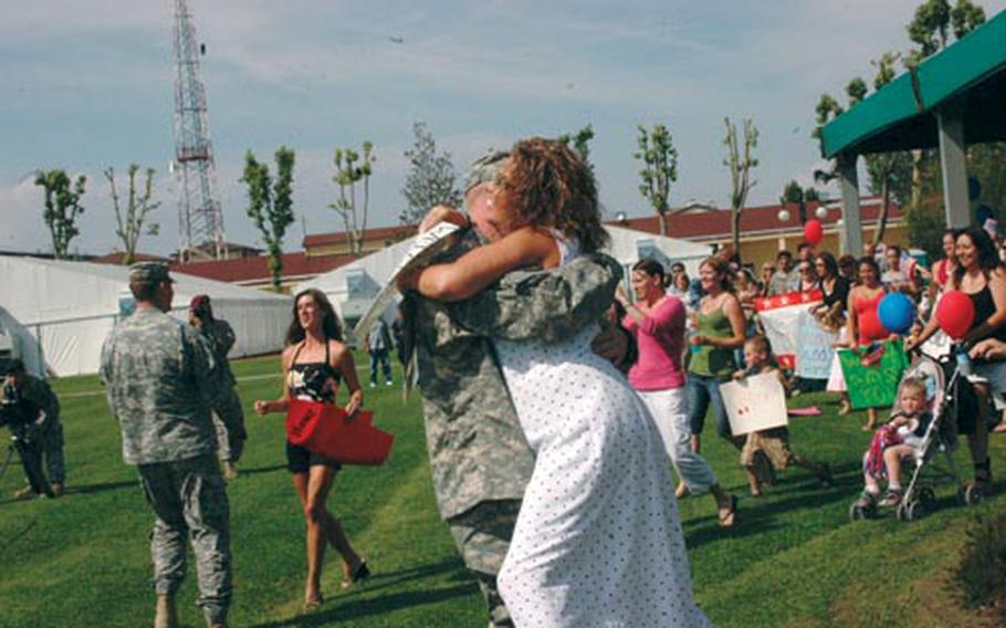 Jenna Ward led the pack of eager spouses who ran out onto field at Caserma Ederle in Vicenza to meet their husbands, who returned Thursday afternoon from a 13-month deployment to Afghanistan.