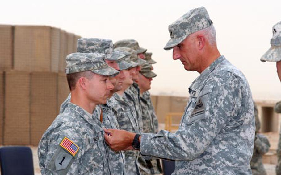 Lt. Col. James H. Bradley, Jr., commander of the 3rd Assault Helicopter Battalion, receives the Silver Star for his actions during an operation east of Balad, Iraq on Jan. 16, 2008. Maj. Gen. Mark P. Hertling awarded the medals during a ceremony at Contingency Operating Base Speicher on June 14.