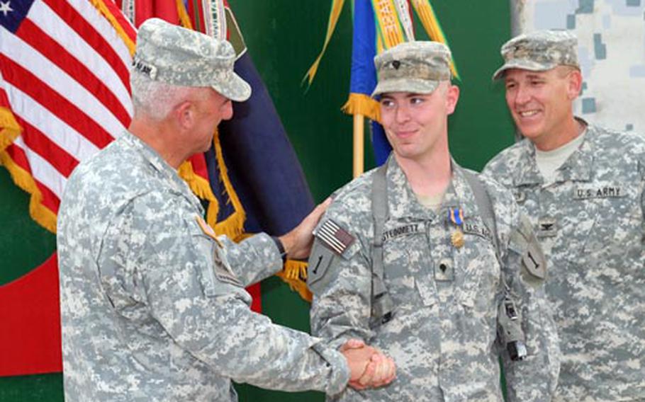 Spc. Kenneth Steinmetz, a door gunner with Company B, 3rd Assault Helicopter Battalion, 1st Aviation Regiment, receives the Air Medal with “V” Device during a ceremony on June 14.