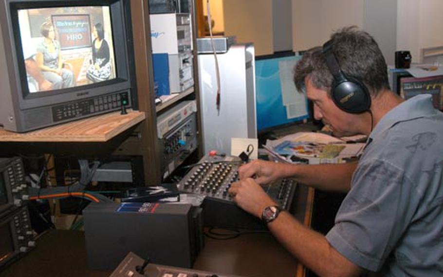 Gary Hughes, an engineer for Kadena Air Base Services TV, works the sound board during a recent taping of “Highlights” inside the marketing department’s studio. “Highlights” is one of several programs featured on the local cable channel operated by the 18th Force Support Squadron’s marketing department.