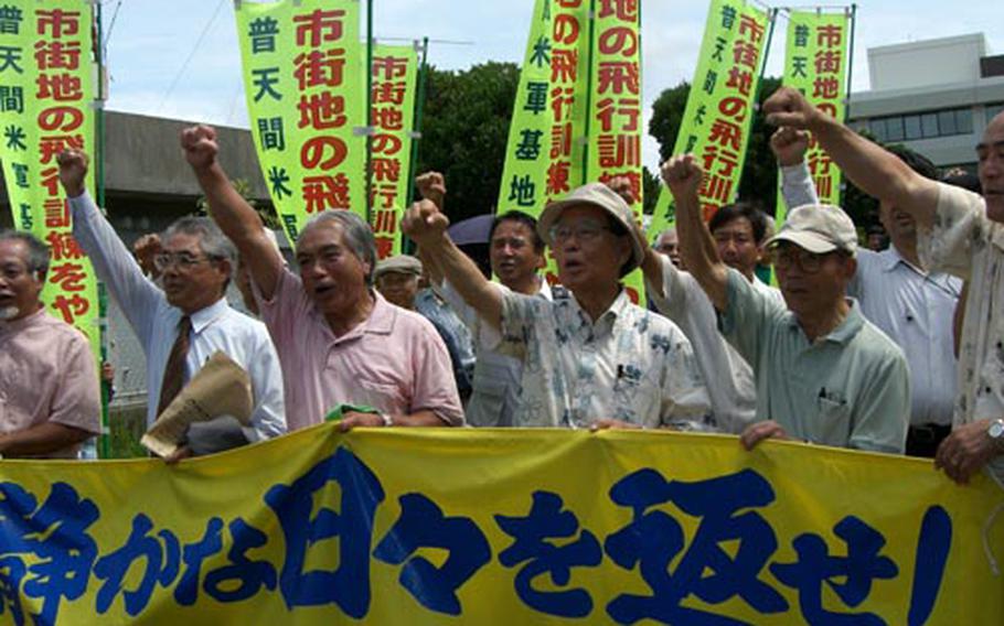 About 100 residents and their supporters Thursday gather at the Okinawa Branch of Naha District Court in Okinawa City to hear the ruling on a six-year lawsuit.