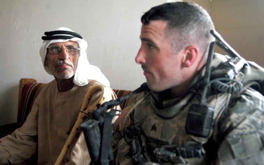 Sgt. Kyle McNeal, 28, from Minnesota&#39;s 407th Civil Affairs Battalion, listens to complaints about a recent security operation by Iraqi National Police in villages south of Baqouba. Al Abarra&#39;s mukhtar, or leader, Abud Al Wahed Hussein Muhammed, sat next to McNeal in the village&#39;s Iraqi Police station on Wednesday.