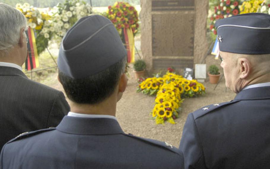 Maj. Gen. James Hunt, the director of Air and Space Operations, Headquarters, U.S. Air Forces in Europe [right] and Col. Donald Bacon, the commander of Ramstein&#39;s 435th Air Base Wing, pay respects during a ceremony Thursday in remembrance of those who died 20 years prior in a devastating air show crash at Ramstein Air Base. Three aircraft from Italy&#39;s precision-flying team Frecce Tricolori collided during an aerial maneuver killing 67 bystanders and injuring more than 500 others.