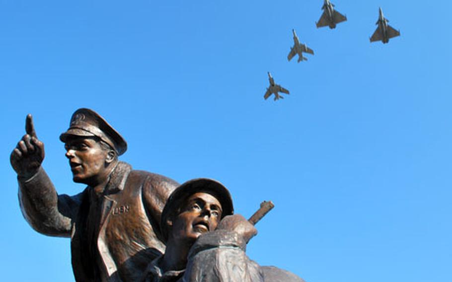 French jets fly over the new monument to the U.S. Navy at Utah Beach, which was unveiled during a ceremony Saturday before a crowd of at least 1,000 spectators, including a handful of U.S. and French veterans and the widows of two men who were at the landing. Though it has been 64 years since the D-Day invasion, this is the first memorial to the U.S. Navy at Normandy.