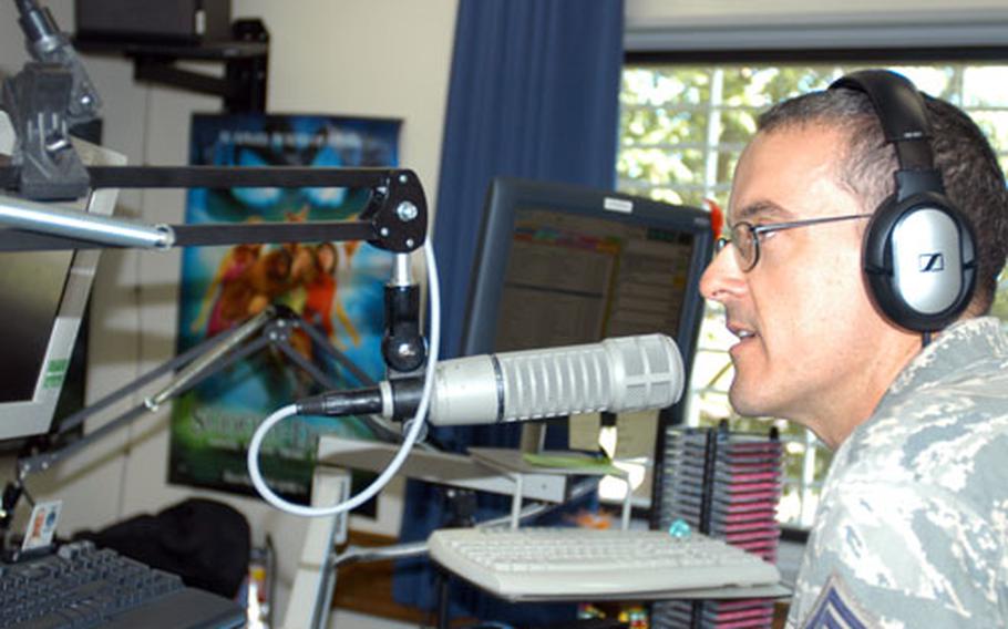 Senior Master Sgt. Larry Schneck, an Armed Forces Network DJ, talks on air at AFN Misawa, Japan.