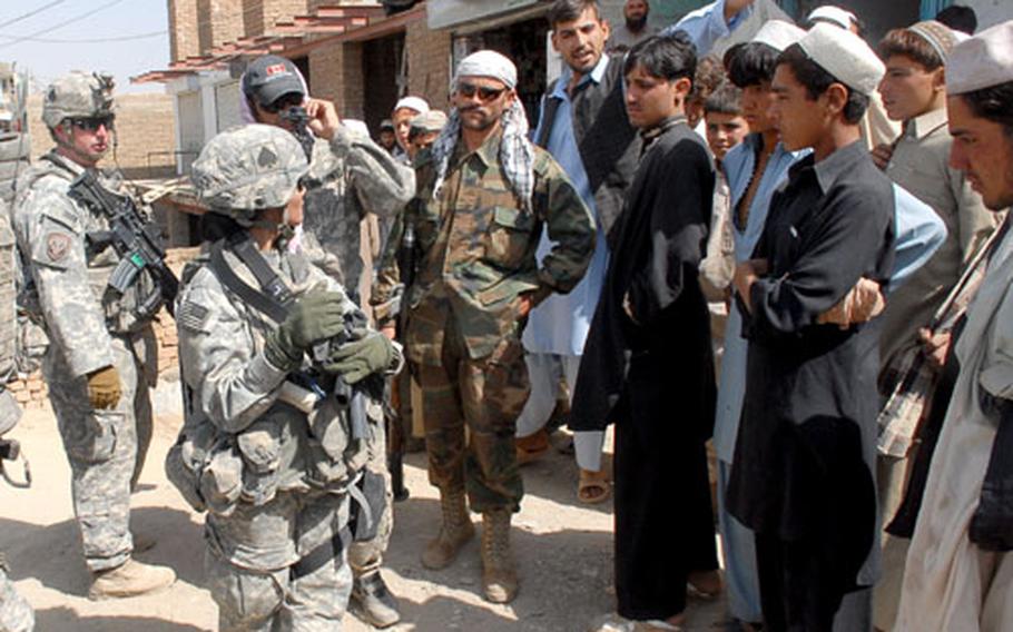 Sgt. Susana Lovko listens to a man complain about deteriorating security in Pul-E Alam, Logar province in late August. Like other areas bordering Kabul, Logar has seen a spike in insurgent attacks this year, which U.S. commanders see as part of an effort to foster the perception of isolation in the capital. Lovko&#39;s platoon of military police, the only U.S. unit in northern Logar, covers an area of roughly 700 square miles.