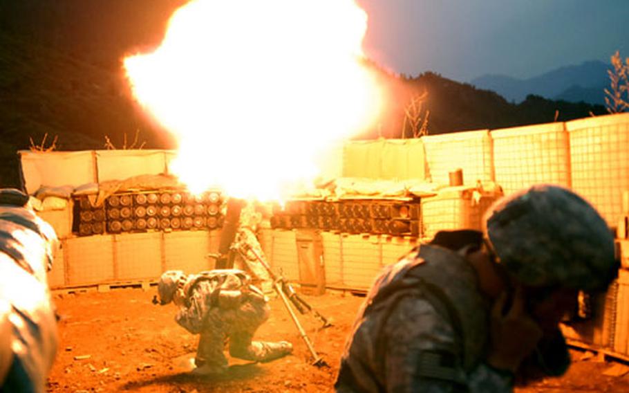 Soldiers at a combat outpost in Konar province&#39;s Gowardesh Valley fire a mortar in late September. With troops spread thin, units use air power and indirect fire to outgun insurgents.