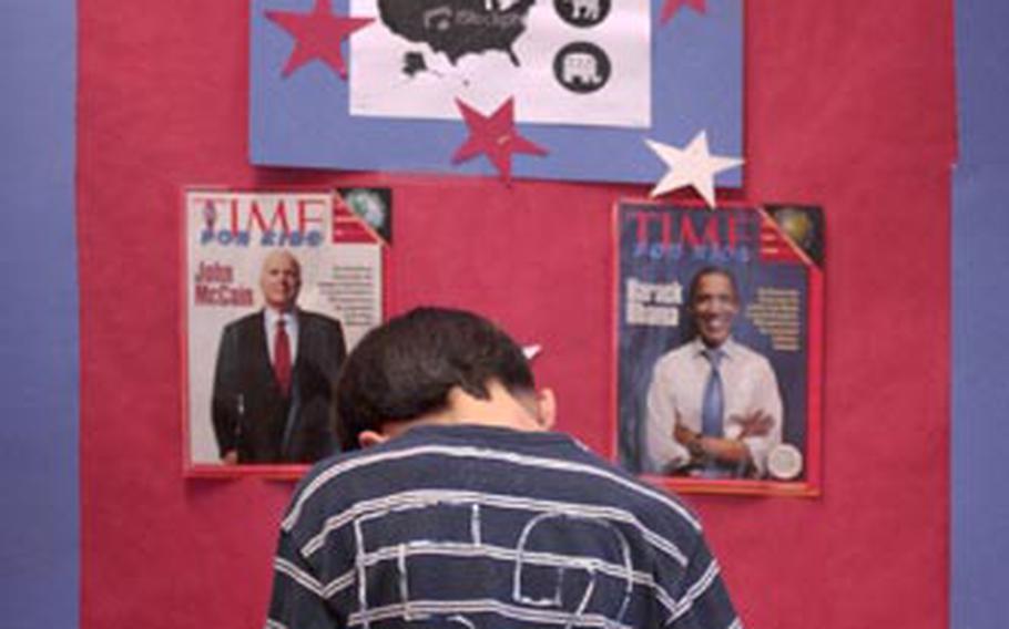 Fifth-grader Morgan Rogers casts his vote. As a learning tool for the electoral process, students pretending to be the presidential candidates gave speeches during two assemblies at the combined elementary and middle school and students then voted back in their classrooms.