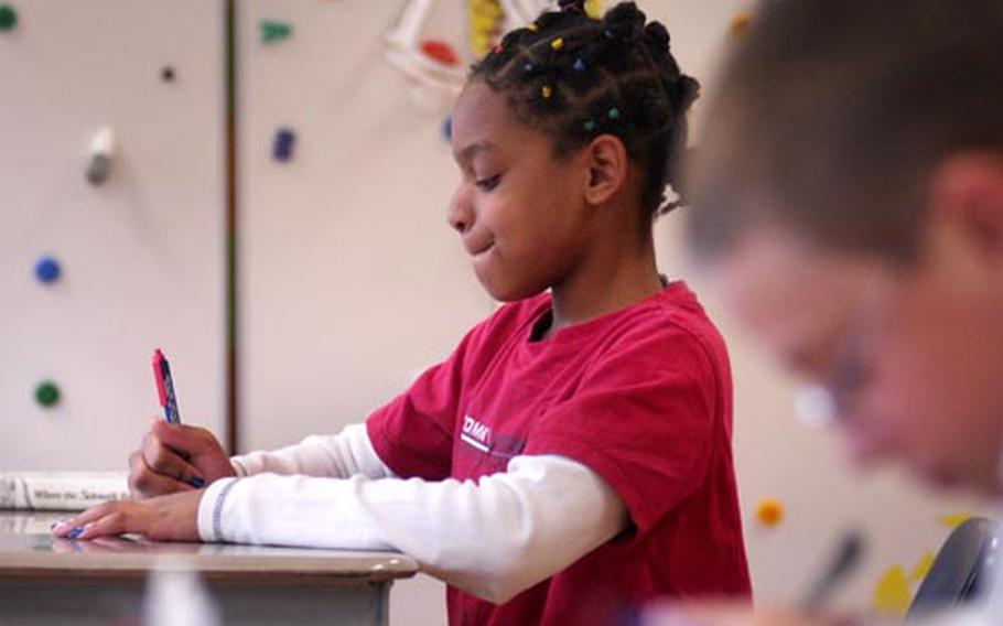 Fifth-grader Jade Easter fills out her ballot.