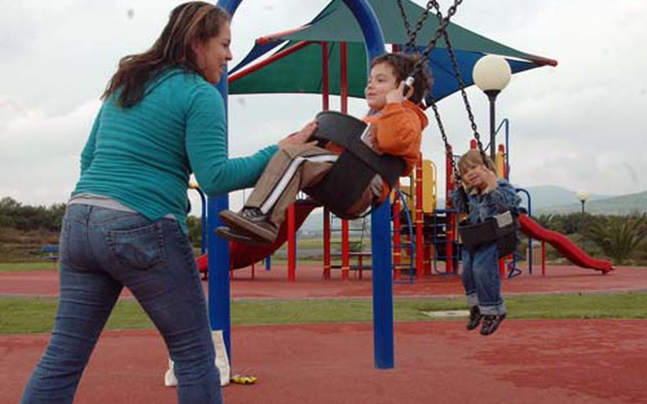 Joanne Aceves, who works for the Child Development Home project at the Navy&#39;s Mineo housing complex in Sicily, takes full advantage of the playgrounds at the government quarters when weather permits. She likes living in Mineo, in spite of its long distance from the Naval Air Station Sigonella&#39;s other bases.