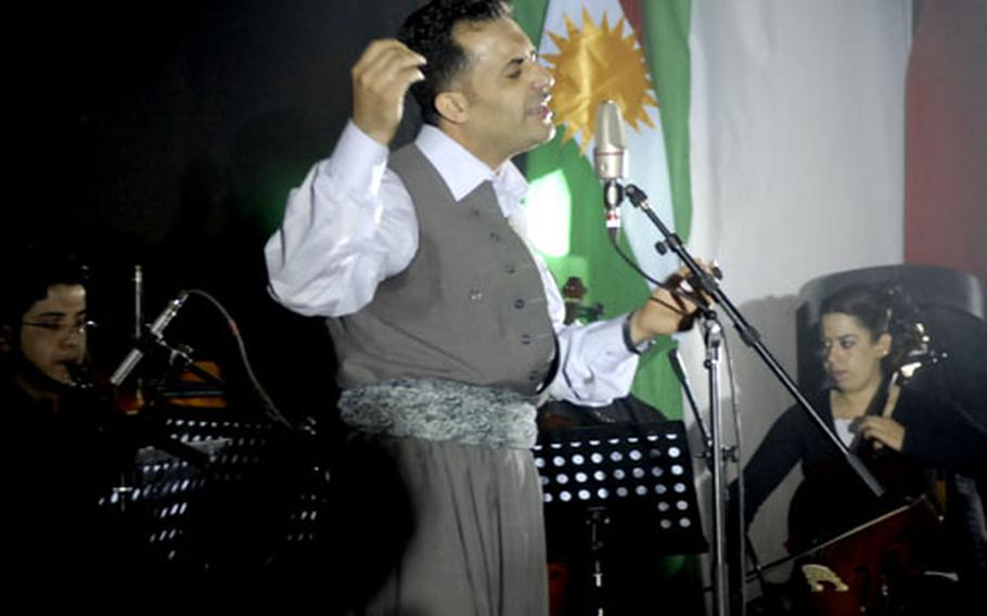 A Kurdish singer belts out a mournful tune during a memorial ceremony in Halabja commemorating a 1988 chemical attack by Saddam Hussein&#39;s forces on that town and surrounding areas that killed as many as 5,000 people.